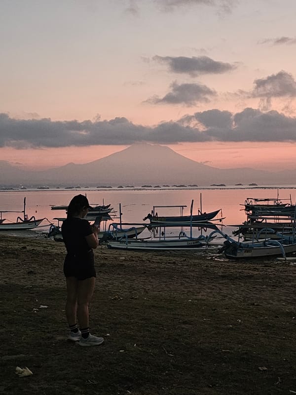 Twilight at the Denpasar coast with Mount Agung on the horizon