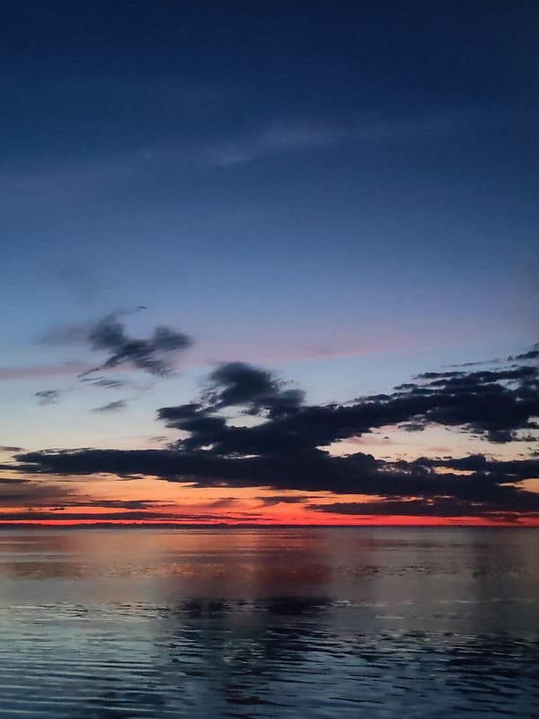 Dramatic sunset observed over water in Mologa, Russia