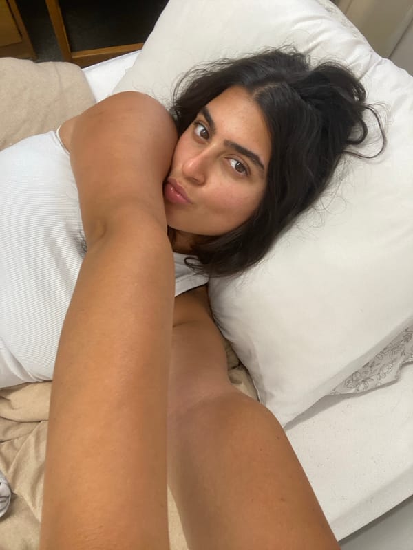 Woman photographed in bedroom portrait session in New York