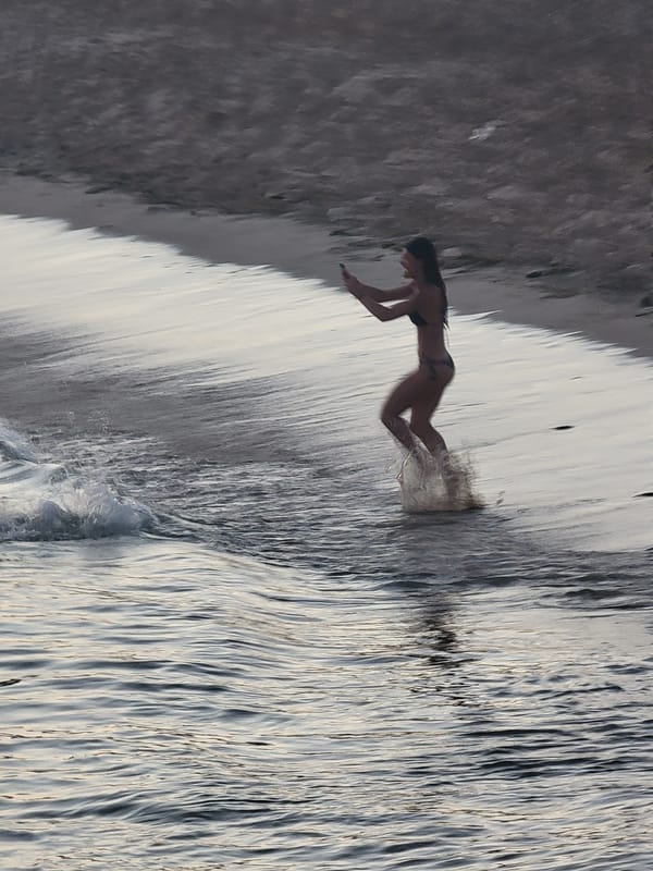 Evening swim and shoreline moments at Quarteira beach