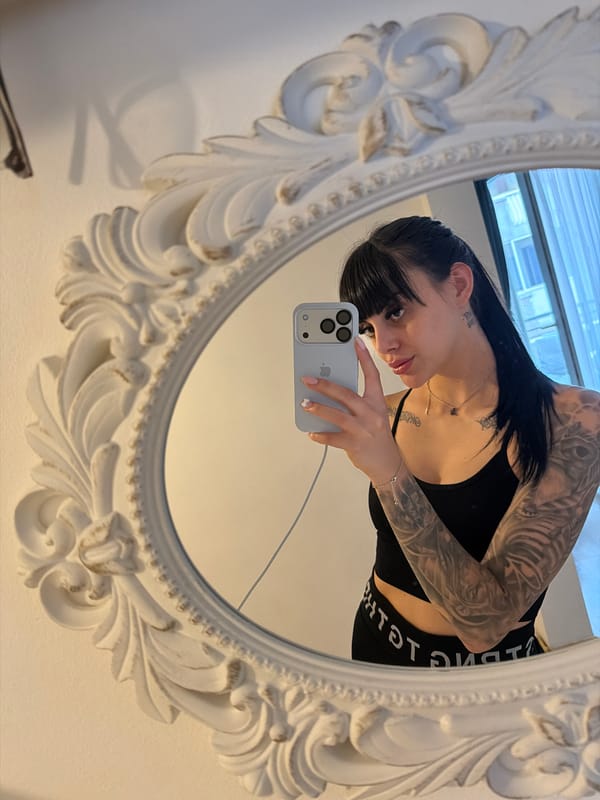 Tattooed woman takes mirror selfie in Plovdiv