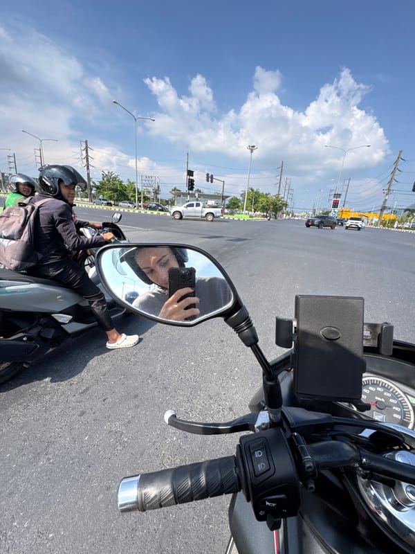 Motorcycle rider documents journey through Ratsada, Thailand with selfies