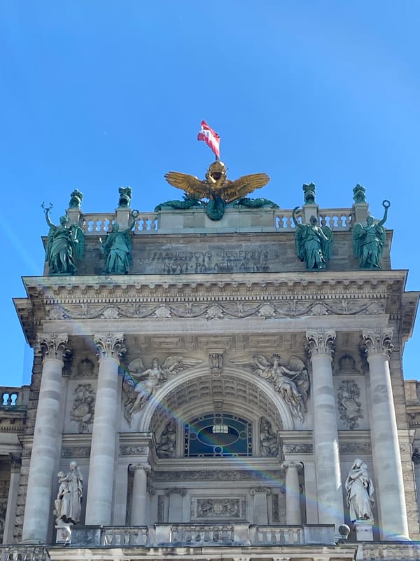 Tourist documents Hofburg Palace architecture during Vienna visit