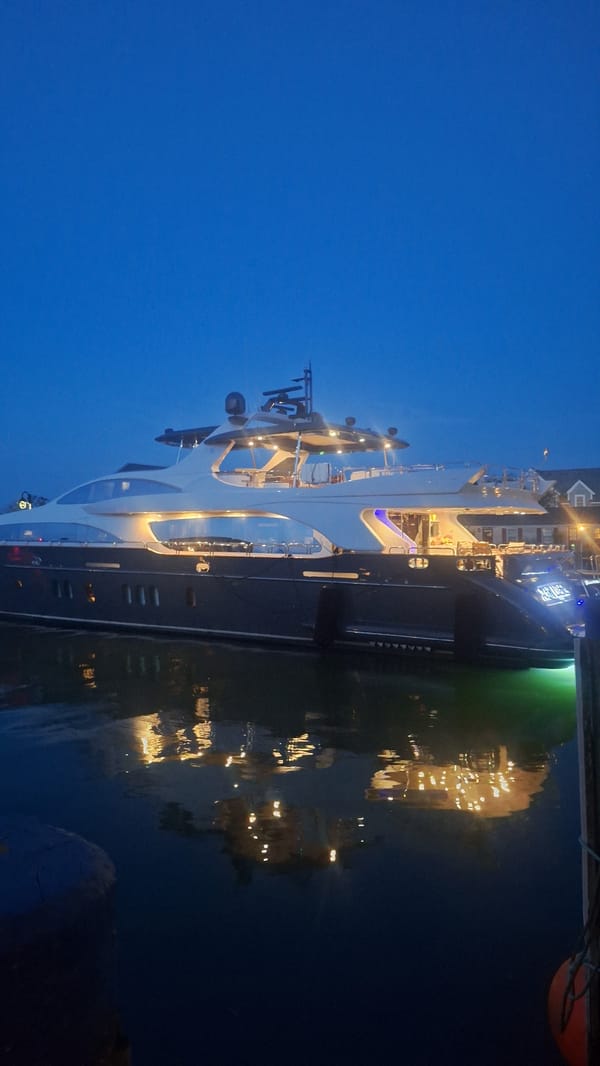 Nantucket harbor fills with yachts as night falls