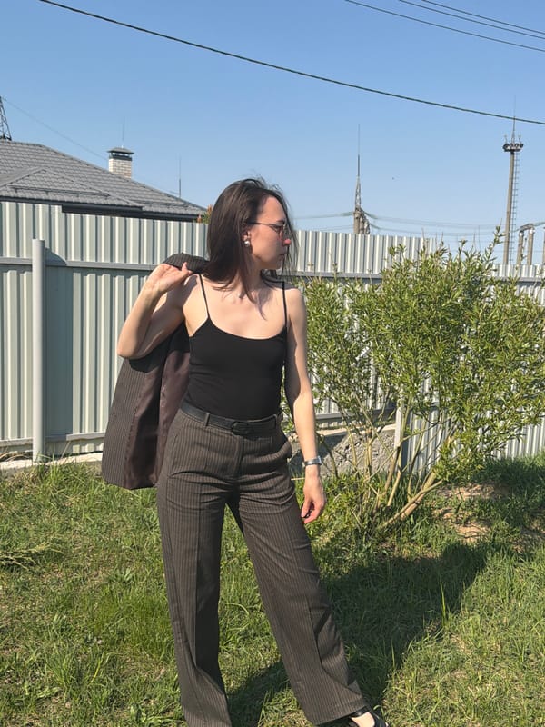 Woman photographed in pinstripe suit around Chaikovsky, Russia