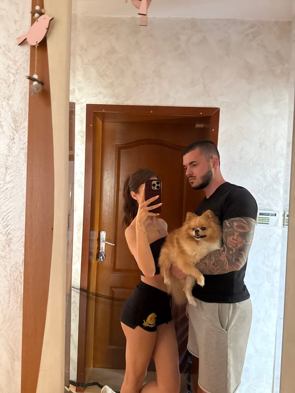 Couple documents lazy afternoon at home with Pomeranian in Bulgaria