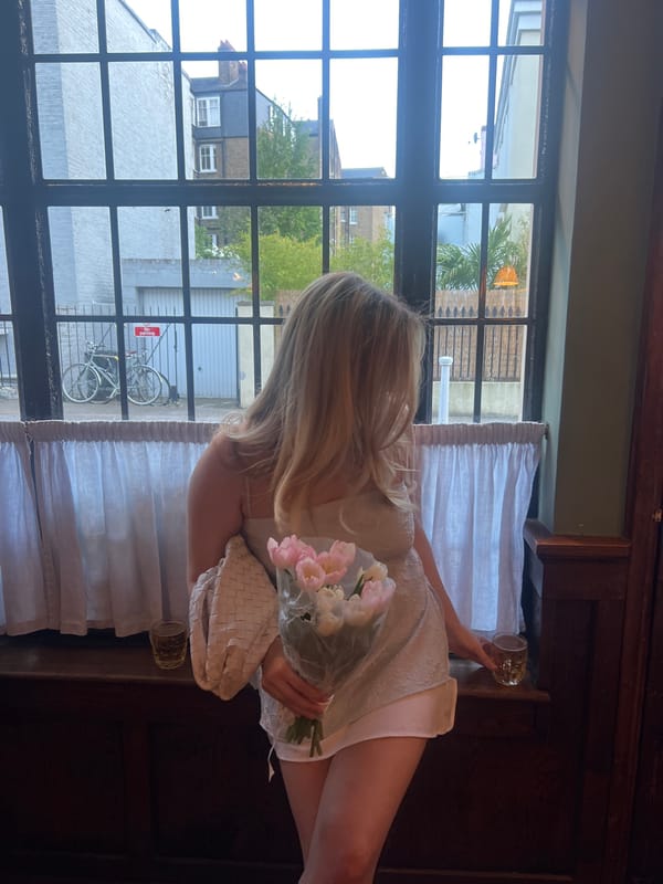 Two women meet at London pub with tulips
