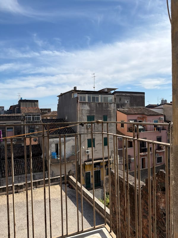 Urban balcony view documented in Catania, Italy