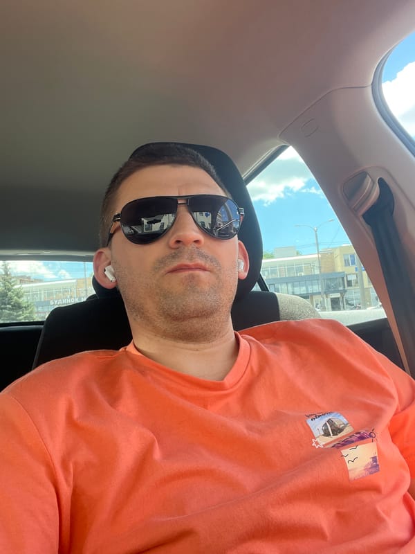 Orange shirt, earbuds, and energy drinks in Kharkiv