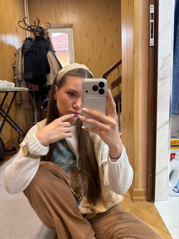 Woman takes morning mirror selfies in Buhovo, Bulgaria