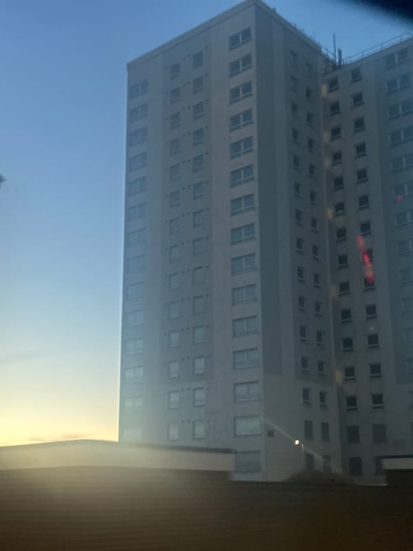 Tall apartment building photographed in East Suffolk evening