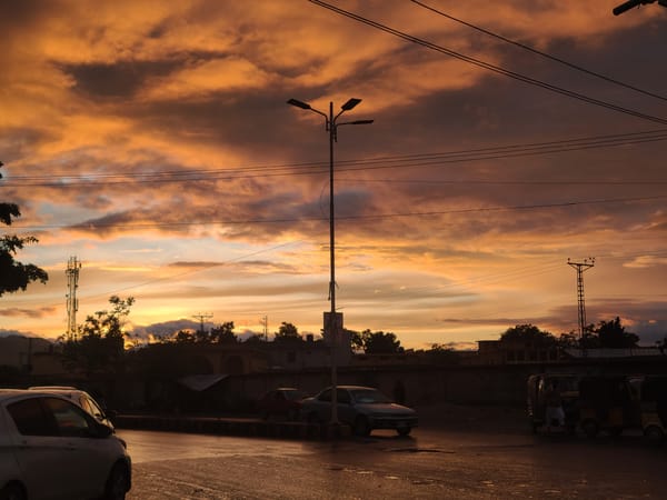 Sunset illuminates wet streets in Quetta, Pakistan