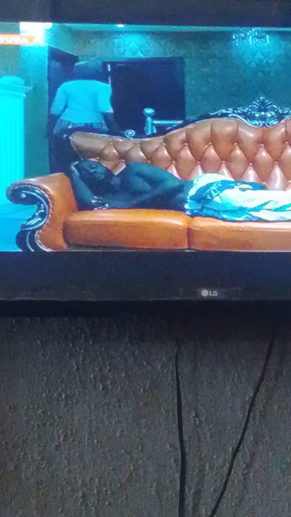 Nigerian viewer watches mixed TV programming in Lokoja morning session