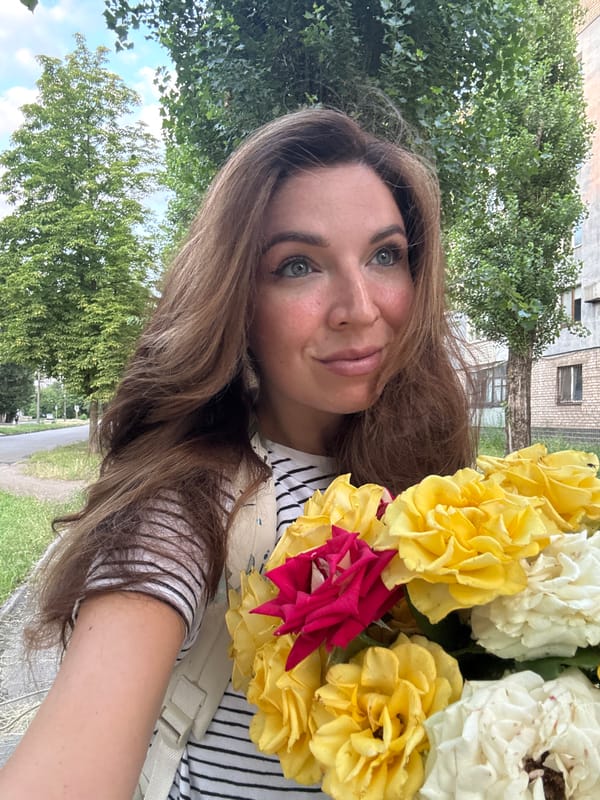 Roses and a roaming cat on a Kryvyi Rih afternoon