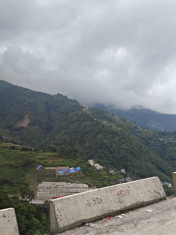 Cloudy morning drive through Chandragiri's hilly rural roads