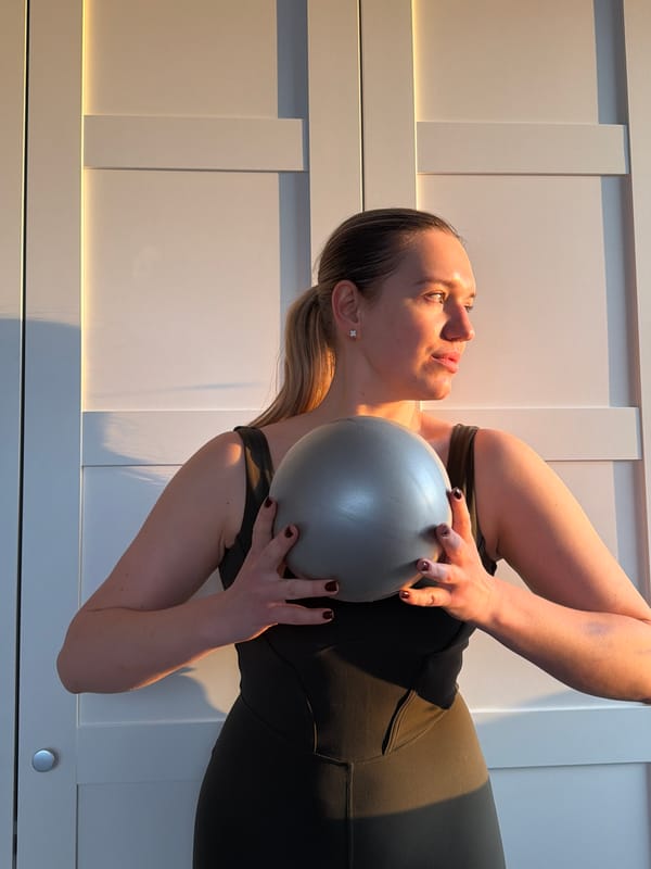 Woman exercises with ball in Dreiliņi, Latvia