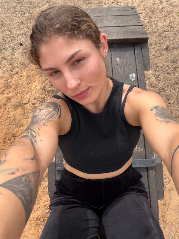 Child plays with shovel at Kiryat Bialik playground