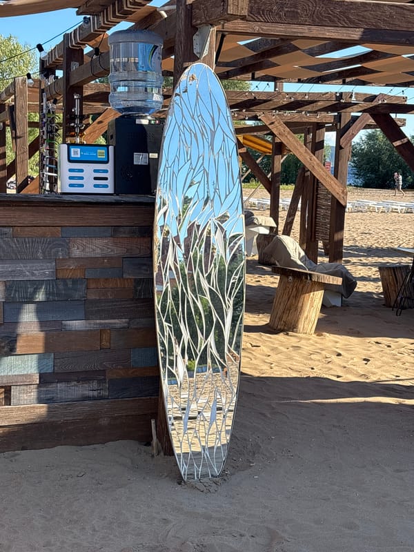 Summer afternoon on the Volga: beach art, paddleboards, and pizza