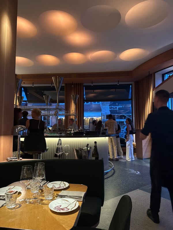 Cocktails and conversation at a busy restaurant table