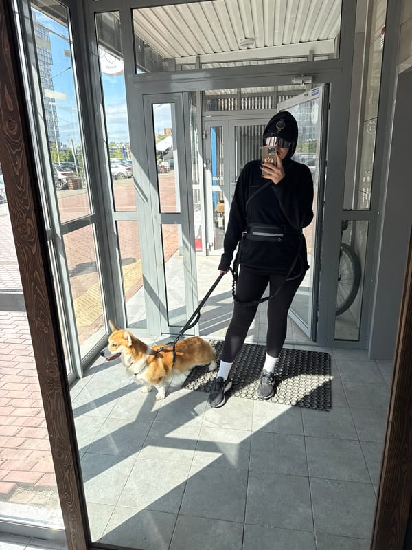 Late-night selfies with corgi during building walk in Krasnoyarsk