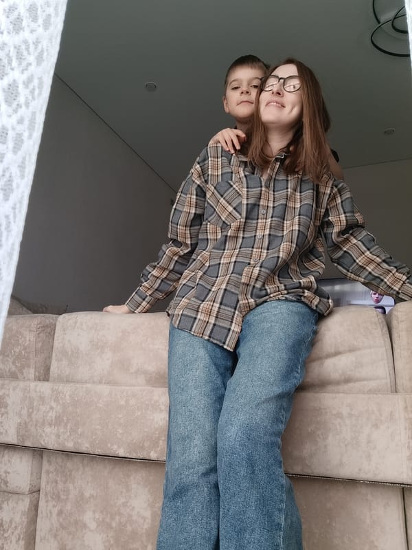 Family moments with pet cat during rainy morning in Chaikovsky