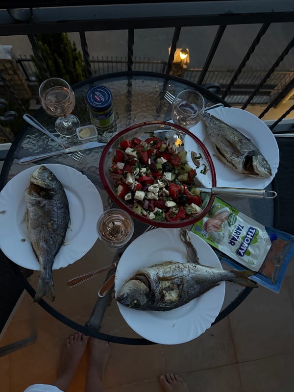 Evening fish dinner served on balcony in Tivat, Montenegro