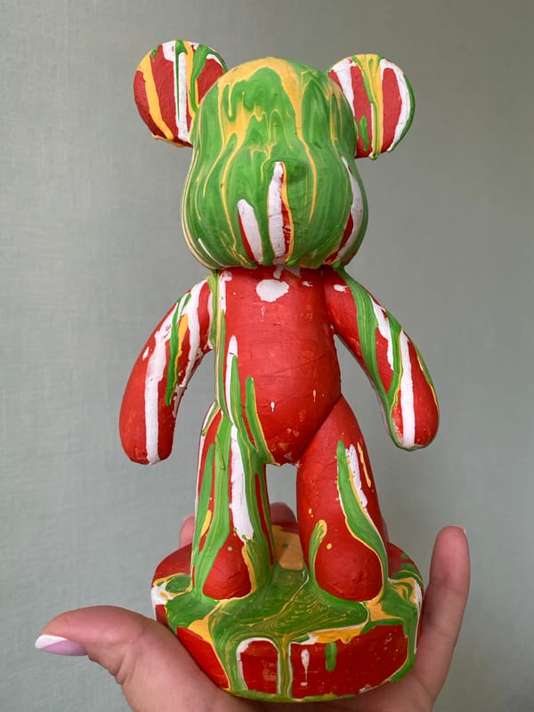 Painted toy bear documented with wooden blocks in Sochi