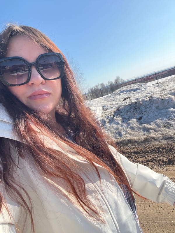 Woman and child enjoy sunny spring outing in Noviy