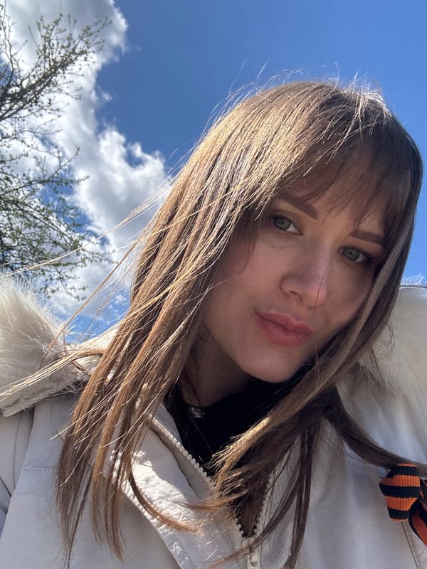 Woman photographs herself outdoors in Chaikovsky, Russia morning session