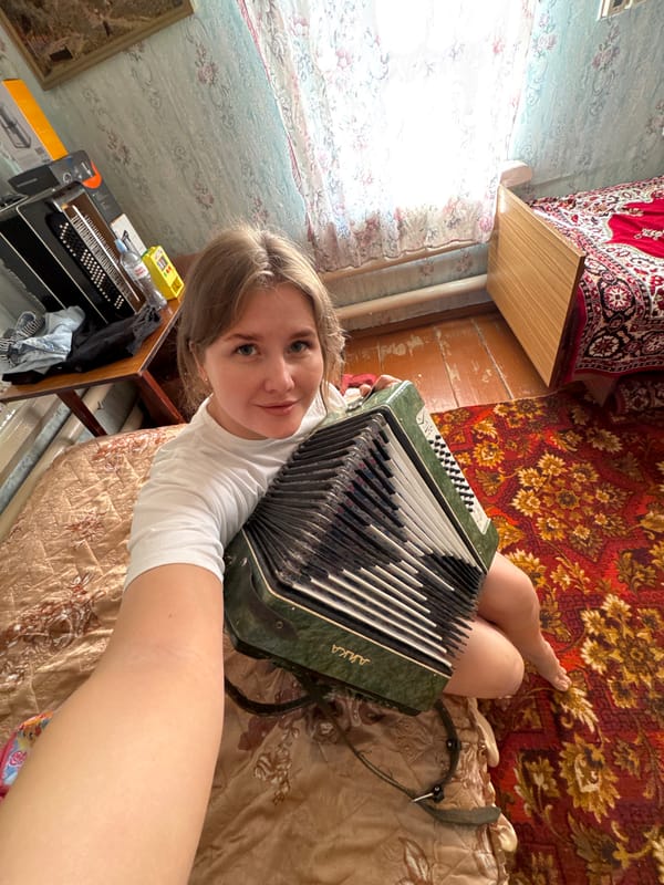 Woman with accordion, decorative gnome spotted in Foki home