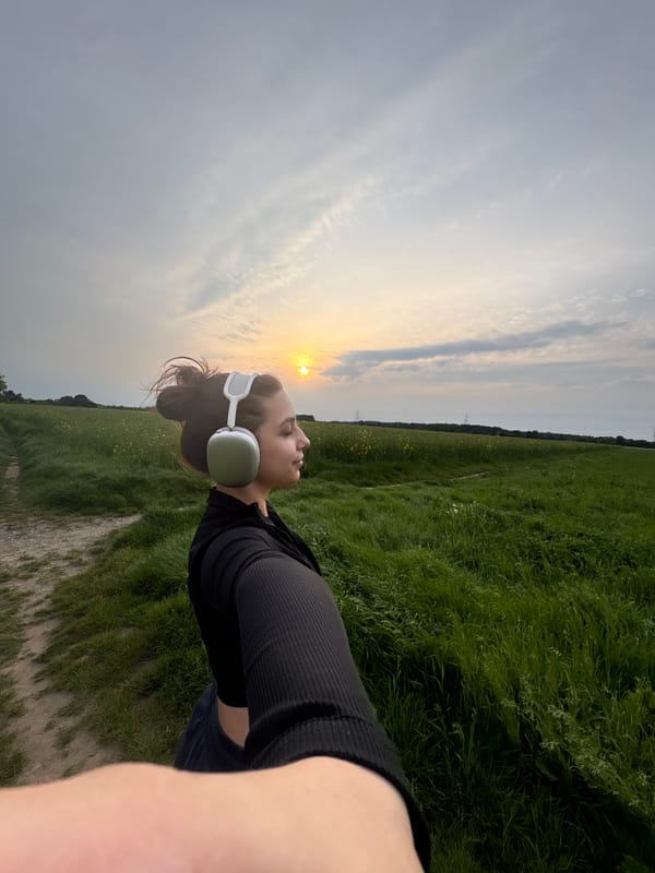 Woman takes sunset selfies in Mönchengladbach field