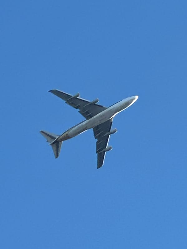 Low-angle aircraft shots over southeast London on a clear afternoon