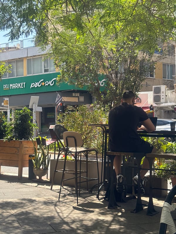 Morning street life documented in Givatayim cafe district