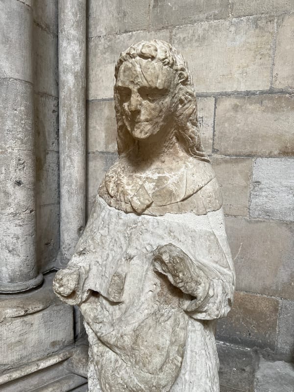 Tourist documents Gothic cathedral interior and artifacts in Rouen