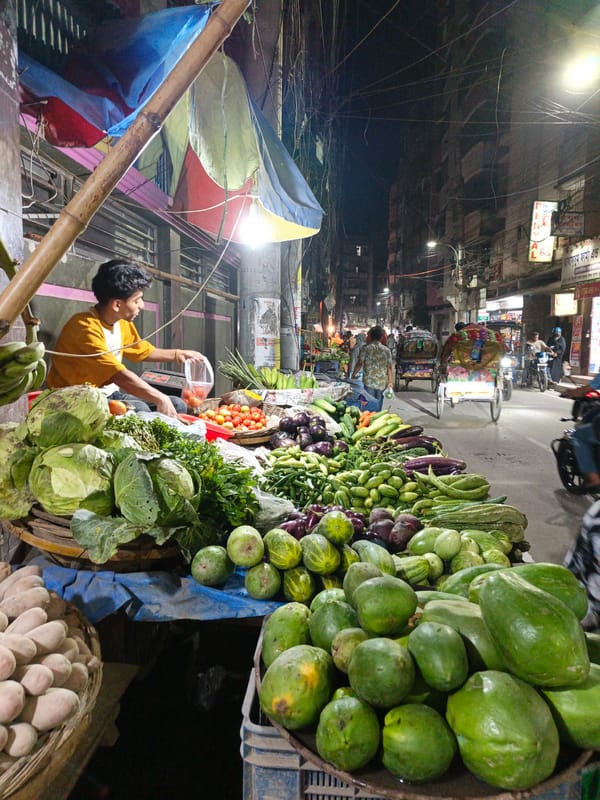 Evening street vendors sell produce, goods in Dhaka