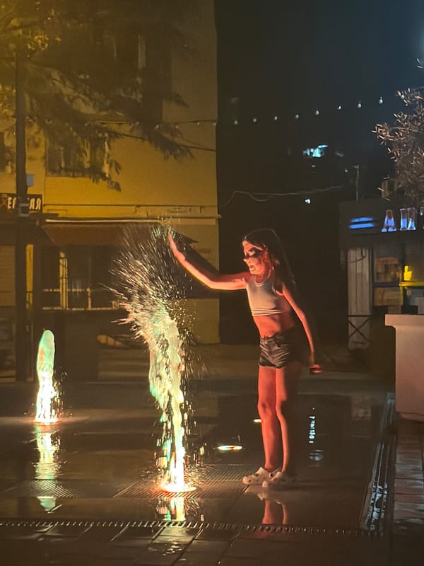 Night fun at an illuminated fountain in Partenit
