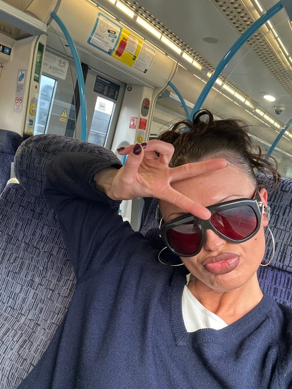 Woman in navy sweater documented during London commute