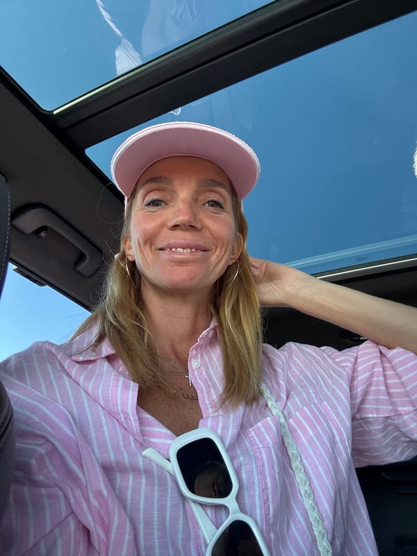 Woman takes selfie in car with sunroof in Kronstadt