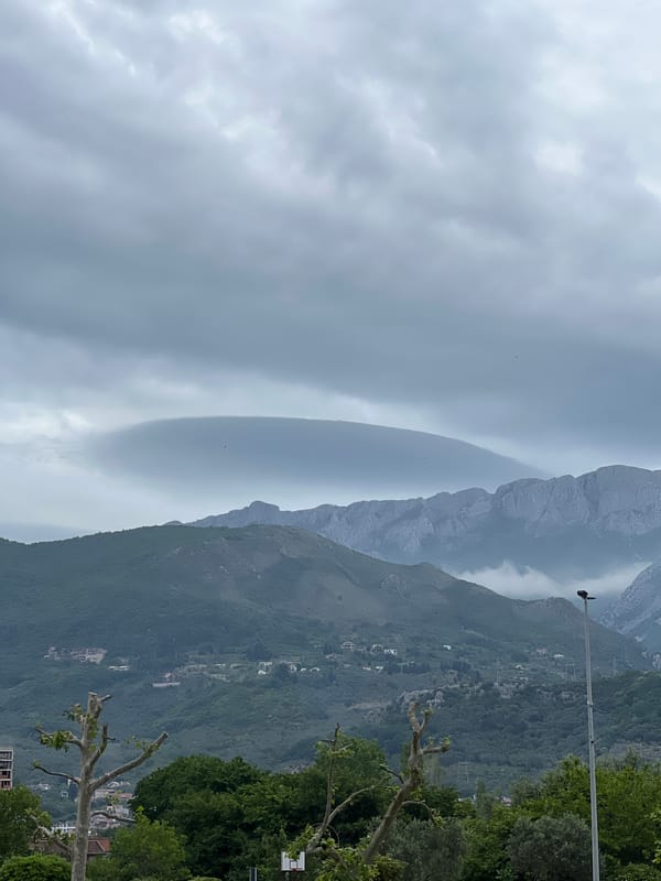 Overcast skies blanket mountainous coastline in Bar, Montenegro