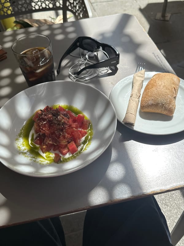 Outdoor lunch and architecture documented in Madrid afternoon