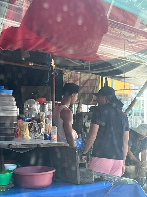 Roadside pineapple vendor serves customer in San Juan Huiluco