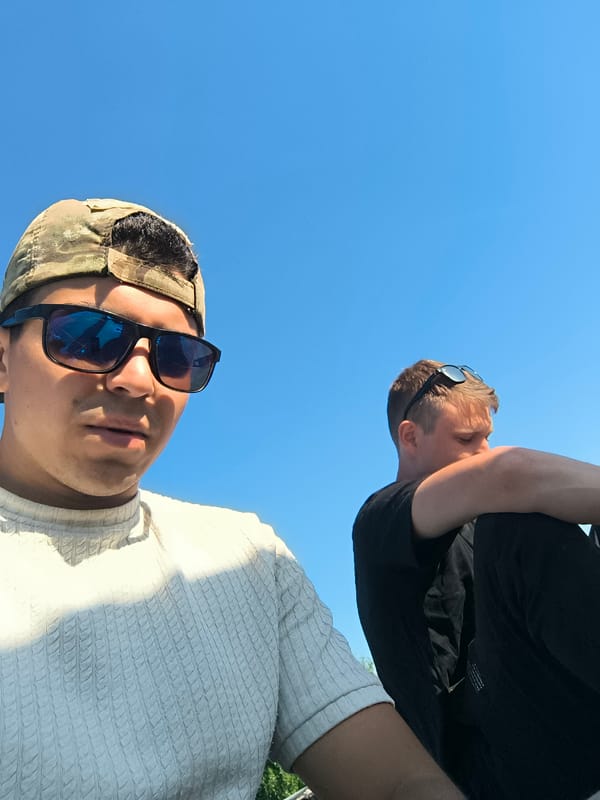 Two men spotted on rooftop in daylight