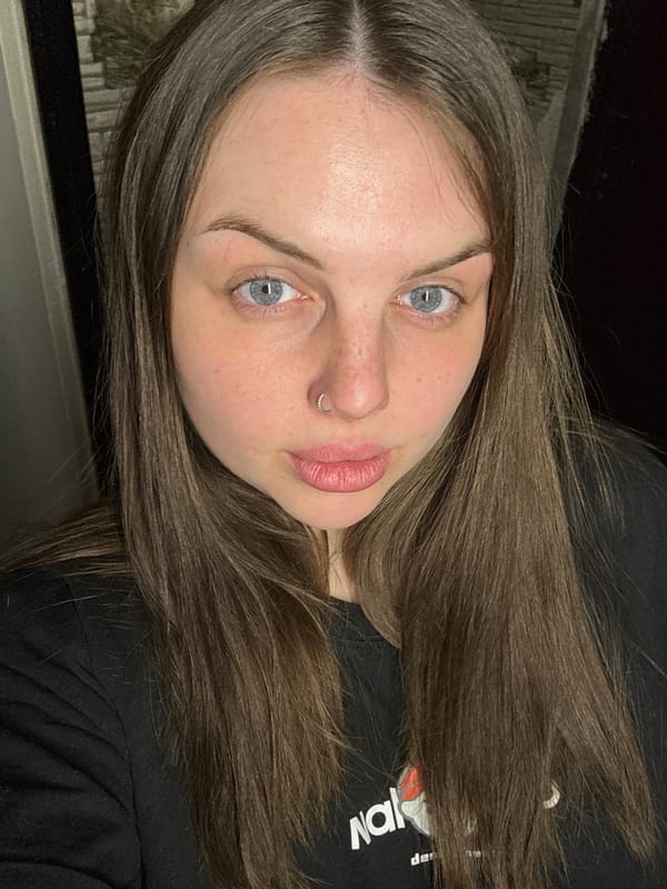 Woman Takes Mirror Selfies in Ukrainian Coastal Town