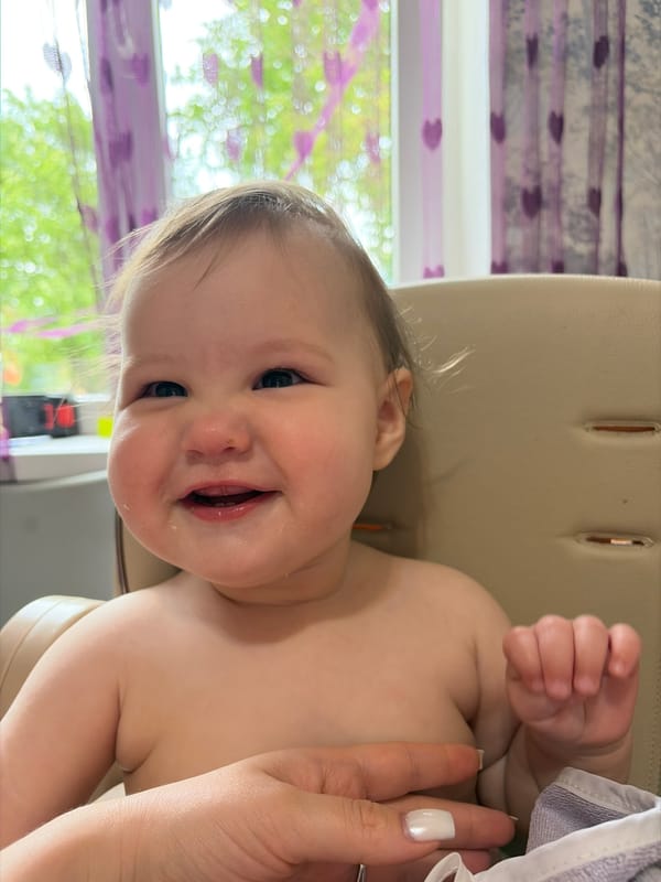Baby's playtime documented in Novopokrovskaya home setting