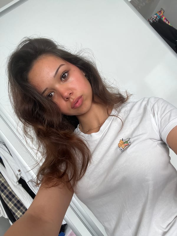 Woman takes morning selfies in bedroom in Zlatograd, Bulgaria