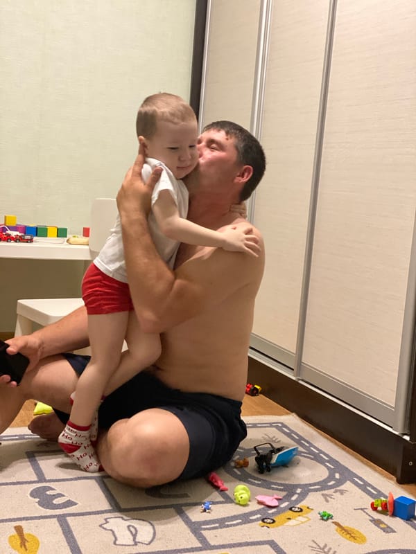 Father and child enjoy playtime in Sochi home