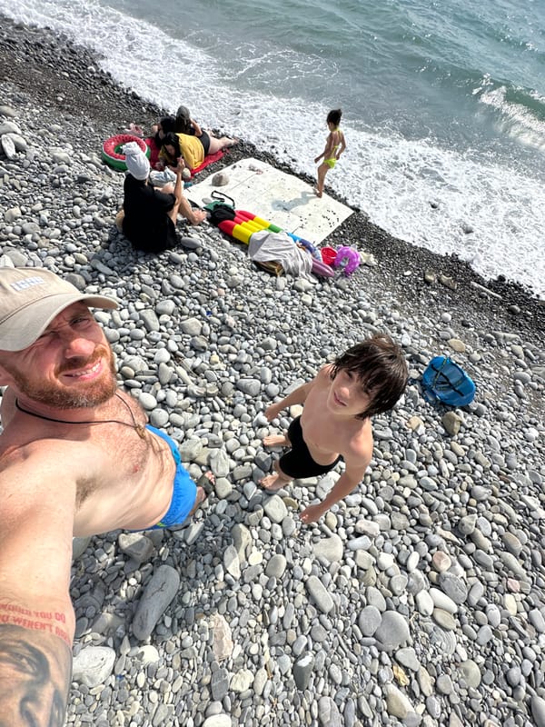 A typical summer afternoon on Sochi's Black Sea pebble beach.