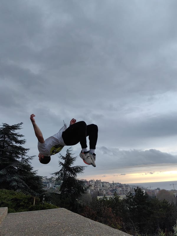 Man performs morning backflips on concrete structure in Varna
