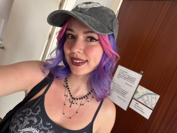 Woman takes mirror selfies in Madrid wearing colorful hair