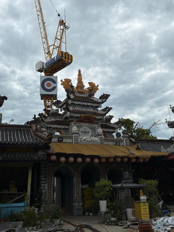 Buddhist temple under renovation in central Đà Nẵng, street life nearby